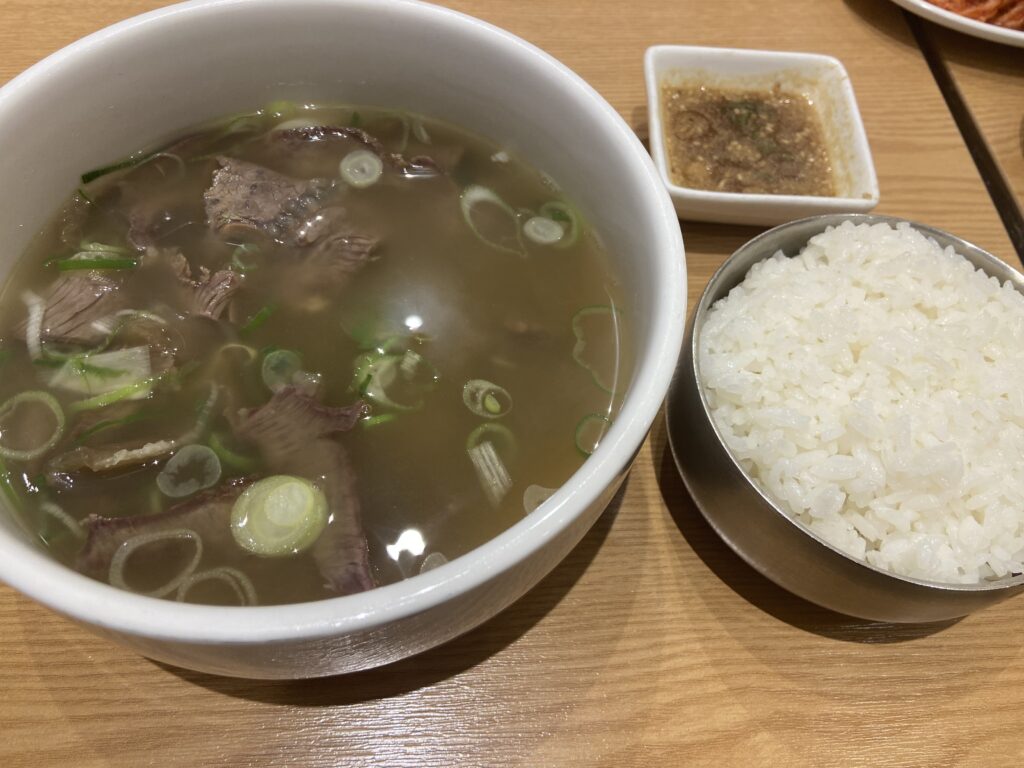 Gomtang, clear beef bone soup, with rice poured in to enrich the flavor—a warm meal before a long flight.